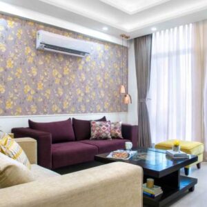 Contemporary 2BHK Flat Design with Cream and Burgundy Sofa